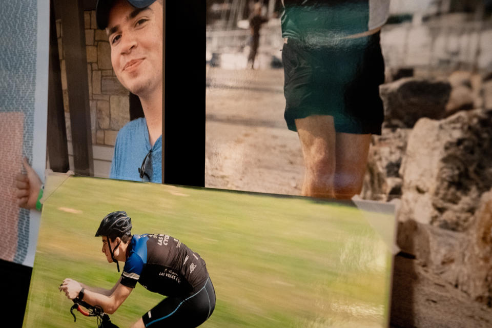 Photos of Brian Lilly Jr. are displayed in Brenda and Brian Lilly's home, Thursday, Oct. 13, 2022, in Easton, Conn. Brian Lilly Jr., 19, who committed suicide on Jan. 4, 2021, was a rower at University of California San Diego. The Lillys have filed a wrongful death lawsuit against the university and the rowing coach, Geoff Bond, who is no longer with the school. (AP Photo/Julia Nikhinson)