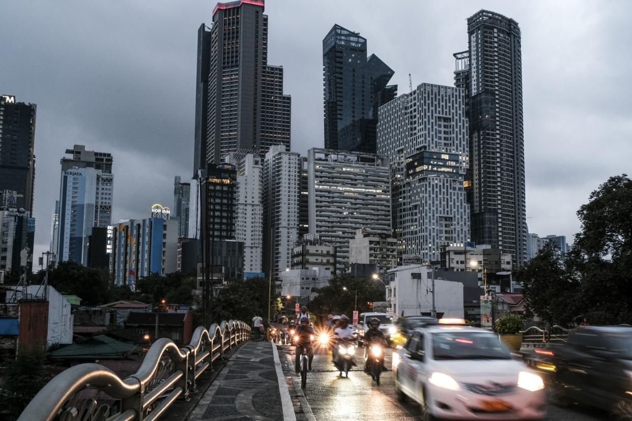 Vehicles travel along an elevated highway in Makati City, Metro Manila, the Philippines, on Monday, Aug. 15, 2022. Bangko Sentral ng Pilipinas delivered an off-cycle rate increase of 75 basis points last month to tame inflation that's almost at a four-year high and prop up the weakening peso.