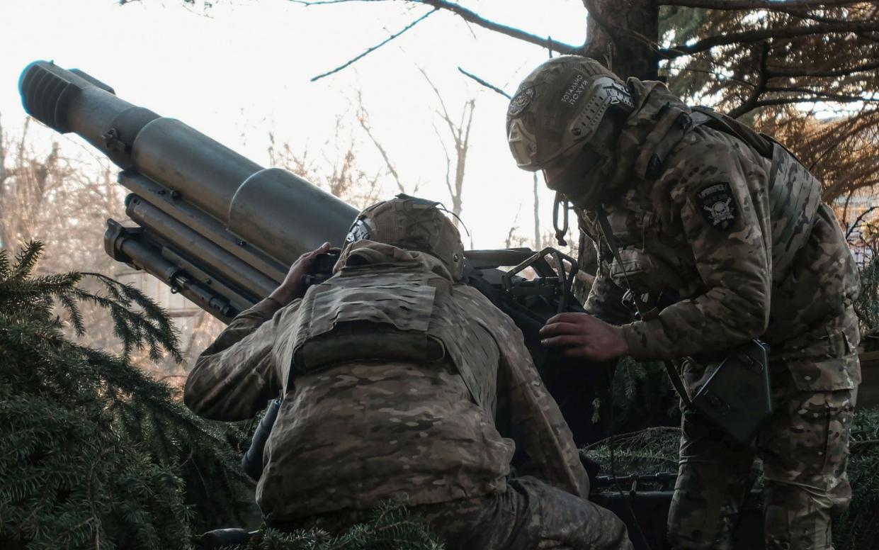 Ukrainian servicemen from the assault brigade 'Bureviy' (Hurricane), a unit of the Ukrainian National Guard, shoot the 105 mm Italian OTO Melara Mod 56 Pack Howitzers from their positions in the Avdiivka direction, at an undisclosed location in the Donetsk area.