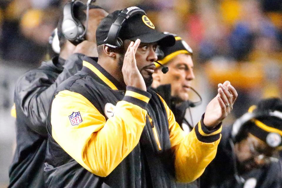Steelers head coach Mike Tomlin, center, and defensive coordinator Dick Lebeau stand on the sideline during a wild card playoff game against the Baltimore Ravens, Saturday, Jan. 3, 2015, in Pittsburgh.