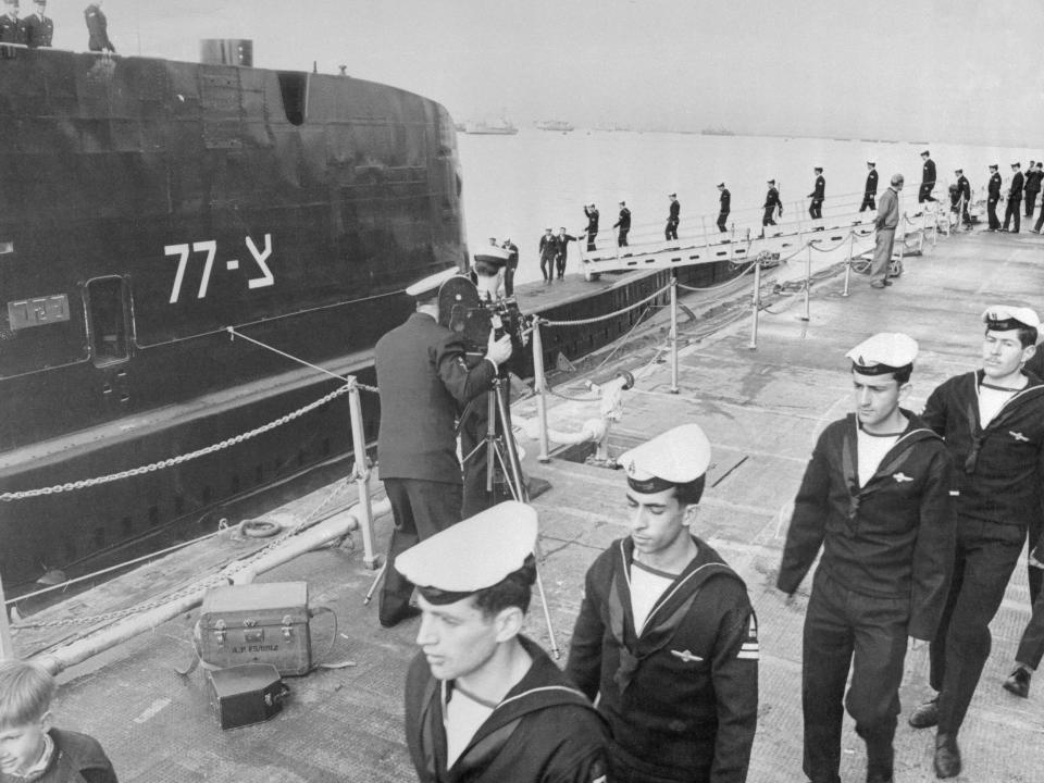 The crew of the Israeli submarine Dakar boards the craft in a photo taken at the sub's commissioning.