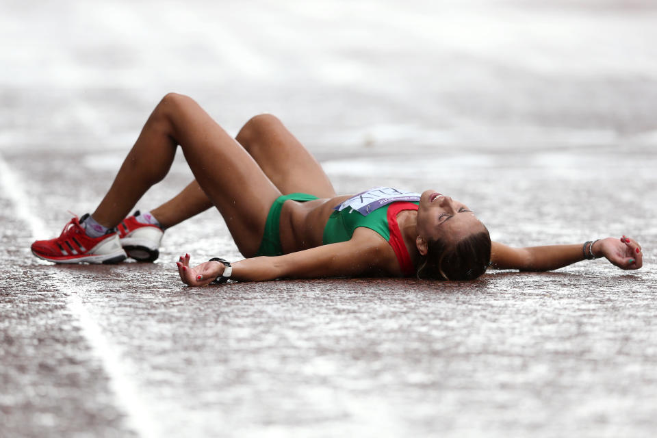 Ana Dulce Felix of Portugal lies on the ground after crossing the finish line during the Women's Marathon on Day 9 of the London 2012 Olympic Games at The Mall on August 5, 2012 in London, England. (Getty Images)