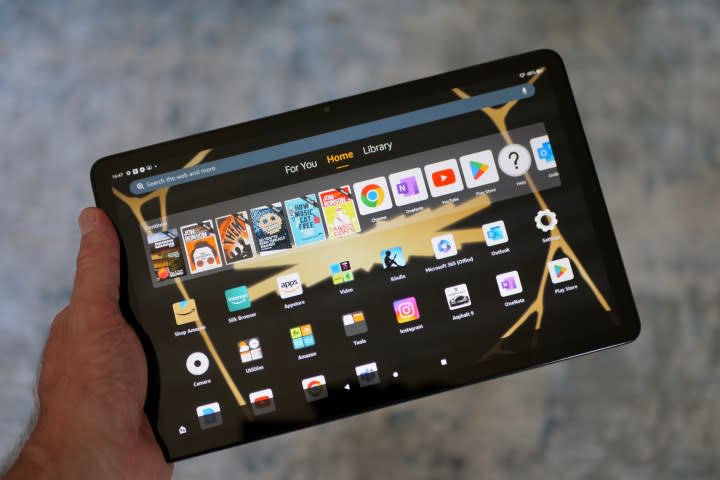 A person holding the Amazon Fire Max 11.