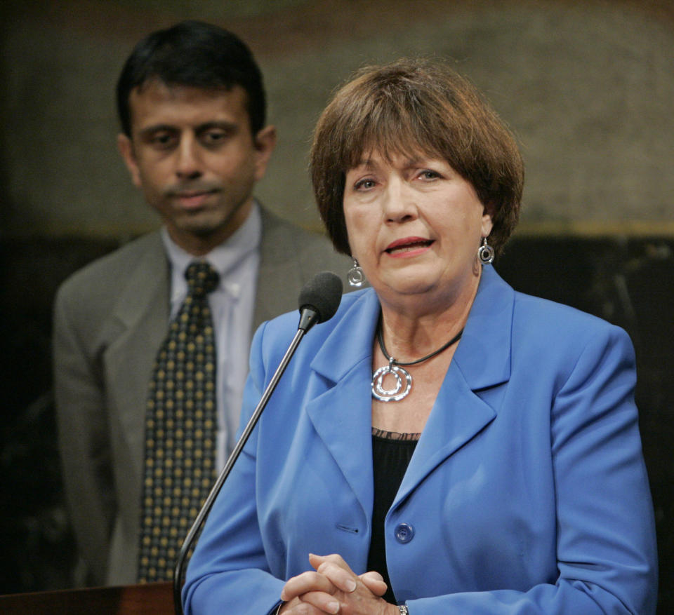 FILE - In this June 11, 2009, file photo, former Louisiana Gov. Kathleen Blanco address a news conference as Gov. Bobby Jindal looks on at the state capitol in Baton Rouge, La. Louisiana Gov. John Bel Edwards’ office confirmed former Louisiana Gov. Kathleen Babineaux Blanco, who became the state’s first female elected governor, died Sunday, Aug. 18, 2019. She was 76. (AP Photo/Bill Haber, File)