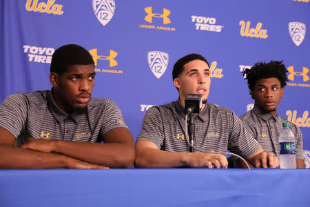 UCLA basketball players Cody Riley, LiAngelo Ball and Jalen Hill speak at a press conference at UCLA after flying back from China, where they were detained on suspicion of shoplifting, in Los Angeles, California U.S. November 15, 2017. REUTERS/Lucy Nicholson