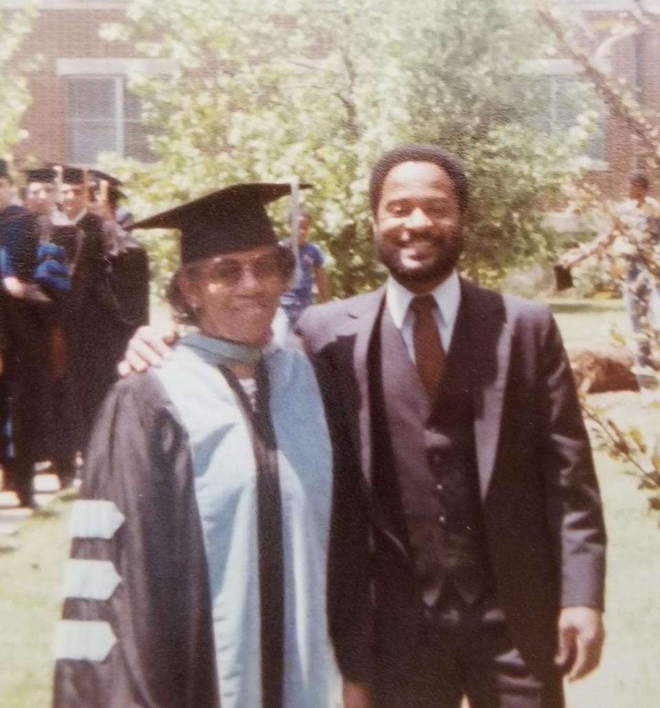 A photo of former FAMU professor, philanthropist Dr. Anne Gayles-Felton (left) with a former student of hers, Marcus Young (right), during a graduation ceremony.