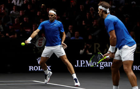 Tennis - Laver Cup - 2nd Day - Prague, Czech Republic - September 23, 2017 - Rafael Nadal and Roger Federer of team Europe in action against Jack Sock and Sam Querrey of team World. REUTERS/David W Cerny