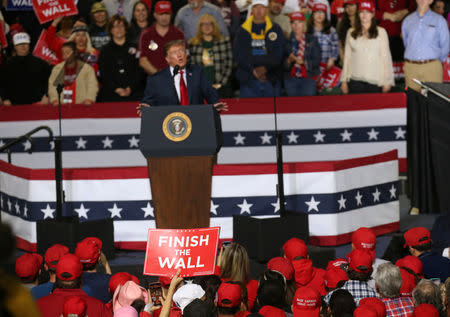 Supporters hold a placard as U.S. President Donald Trump holds a rally at El Paso County Coliseum in El Paso, Texas, U.S., February 11, 2019. REUTERS/Leah Millis