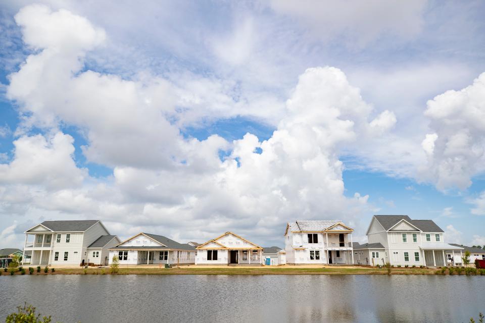 Five homes overlooking a small lake are in the finishing stages of construction in SweetBay. Evidence of growth in the SweetBay development in Panama City is visible in almost every direction Monday, June 28, 2021.