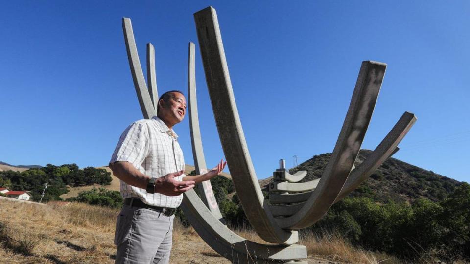 Kevin Dong, Interim Dean of College of Architecture and Environmental Design stands next to Flower, one of the over 20 permenang structers in Poly Canyon. As a student he participated in the annual design village gathering of temporary structures. He walked through the canyon Oct. 5, 2023.