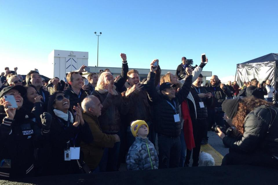 Sir Richard Branson and Sam Branson (both at centre) celebrate the successful Virgin Galactic test flight of SpaceShipTwo (PA)