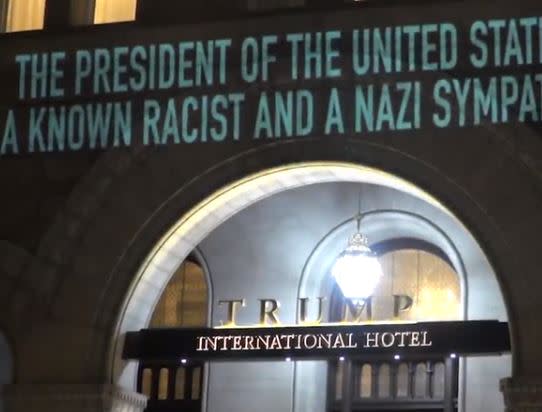 Artist projects 'US President is a Nazi sympathiser' onto Trump Hotel