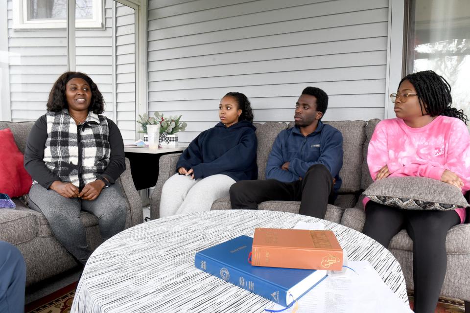 Chantal Nshimiye, Eric Nshimiye's wife, with children Tiffany Nshimiye, Nestor Nshimiye and Destiny Nshimiye at their home April 1.