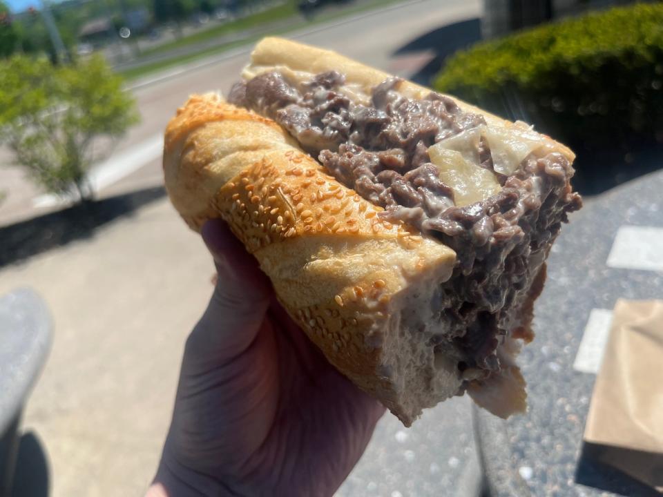 The cheesesteak at Curly's Comfort Foods in Levittown, Pa., features a full pound of ribeye on a seeded Aversa roll. Pictured here is half of a steak.