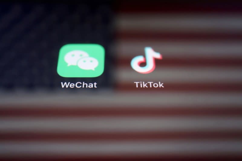 FILE PHOTO: Illustration picture of U.S. flag with WeChat and TikTok