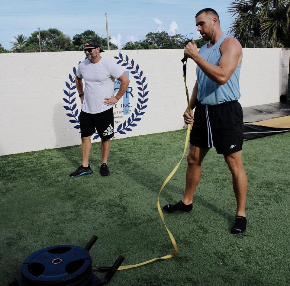 Trainer Andrew Spruill (left) trains with Kansas City Chiefs tight end Travis Kelce (right) in an offseason workout program.