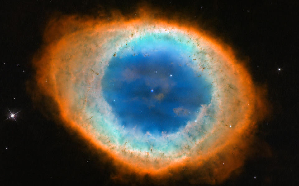 Hubble's view of the Ring Nebula with different colors showing different chemical elements