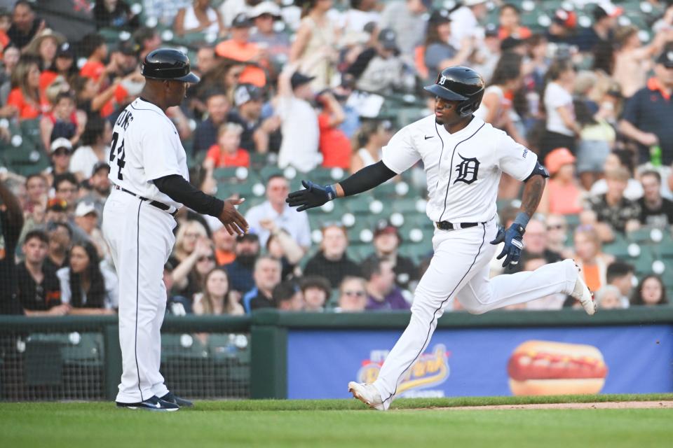 Detroit Tigers third baseman Andy Ibanez (77) celebrates his home run Detroit Tigers third base coach Gary Jones (44) during the fifth inning against the Texas Rangers at Comerica Park in Detroit on Tuesday, May 30, 2023.
