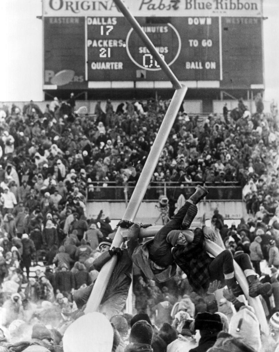 Fans tear down the goal posts after the Packers beat the Dallas Cowboys in the Ice Bowl in 1967 at Lambeau Field.