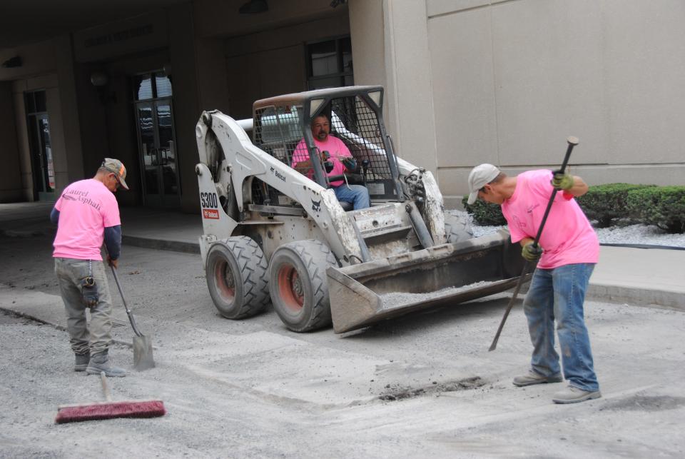 Employees with Laurel Asphalt of Windber wore pink in this file photo while working in Somerset to bring awareness to Breast Cancer Awareness Month.
(Credit: Madolin Edwards/Daily American file)