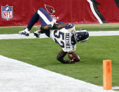 <p>Los Angeles Rams inside linebacker Alec Ogletree (52) falls into the end zone after an interception for a touchdown against the Arizona Cardinals during the first half of an NFL football game, Sunday, Dec. 3, 2017, in Glendale, Ariz. (AP Photo/Ross D. Franklin) </p>