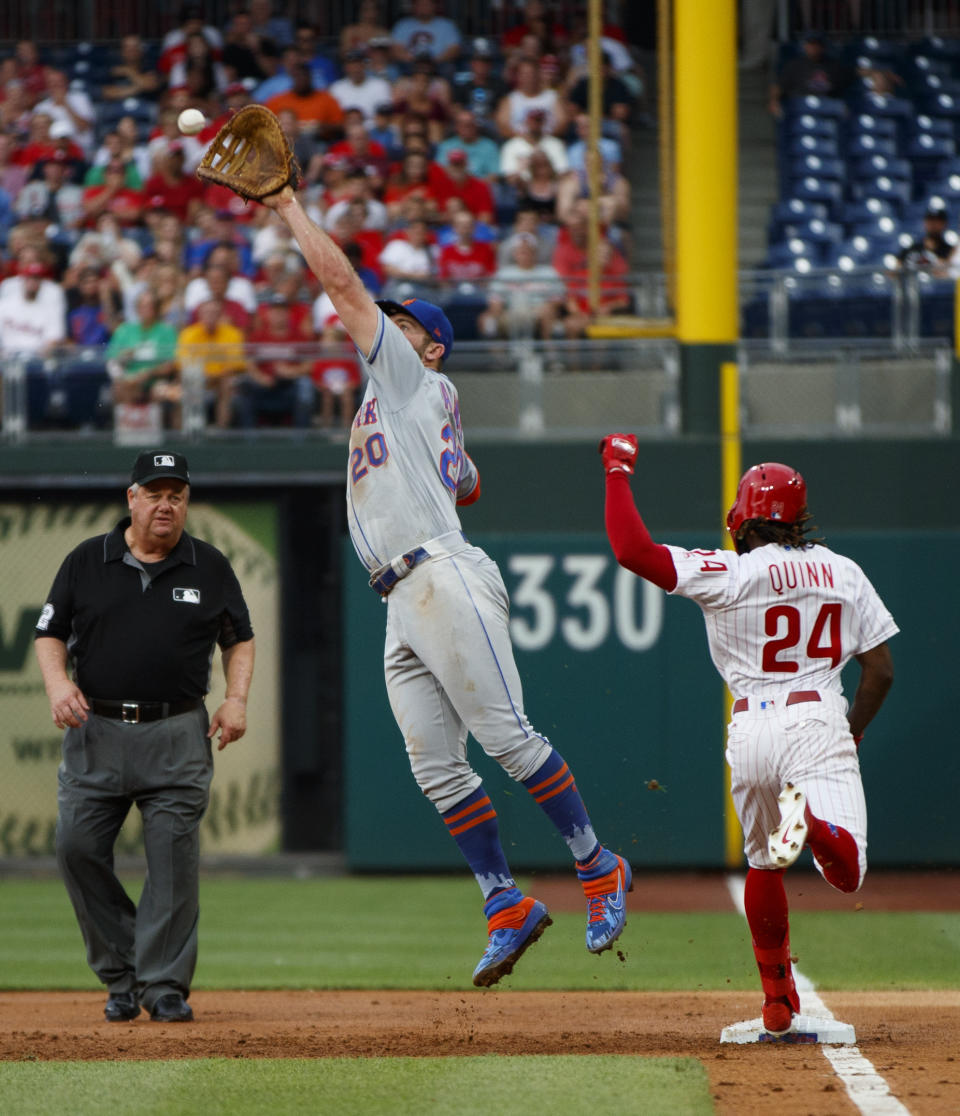 Philadelphia Phillies' Roman Quinn, right, reaches first base as New York Mets first baseman Pete Alonso leaps for the throw on Quinn's run-scoring single during the first inning of a baseball game, Monday, June 24, 2019, in Philadelphia. (AP Photo/Matt Slocum)