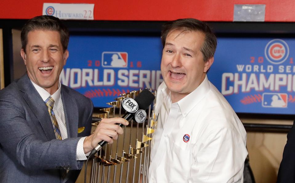 Thomas Ricketts (right) celebrates the Chicago Cubs' World Series championship.