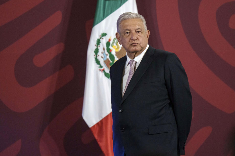 FILE - Mexican President Andres Manuel Lopez Obrador stands on a stage from where he gives his daily press conference at the National Palace in Mexico City, July 8, 2022. Promoting coal is part of Lopez Obrador’s effort to shore up the state-owned power utility, the Federal Electricity Commission. Not only was it questioned by environmentalists; many also said it endangered miners. (AP Photo/Moises Castillo, File)