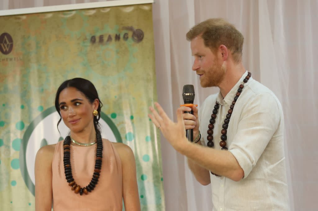 abuja, nigeria may 10 duke of sussex prince harry r speaks as he visits lightway academy withhis wife meghan markle l, duchess of sussex,in abuja, nigeria as part of celebrations of invictus games anniversary on may 10, 2024 photo by emmanuel osodianadolu via getty images