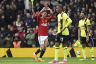 Manchester United's Antony, left, celebrates scoring his side's opening goal during the English Premier League soccer match between Manchester United and Burnley at Old Trafford stadium in Manchester, England, Saturday, April 27, 2024. (AP Photo/Rui Vieira)