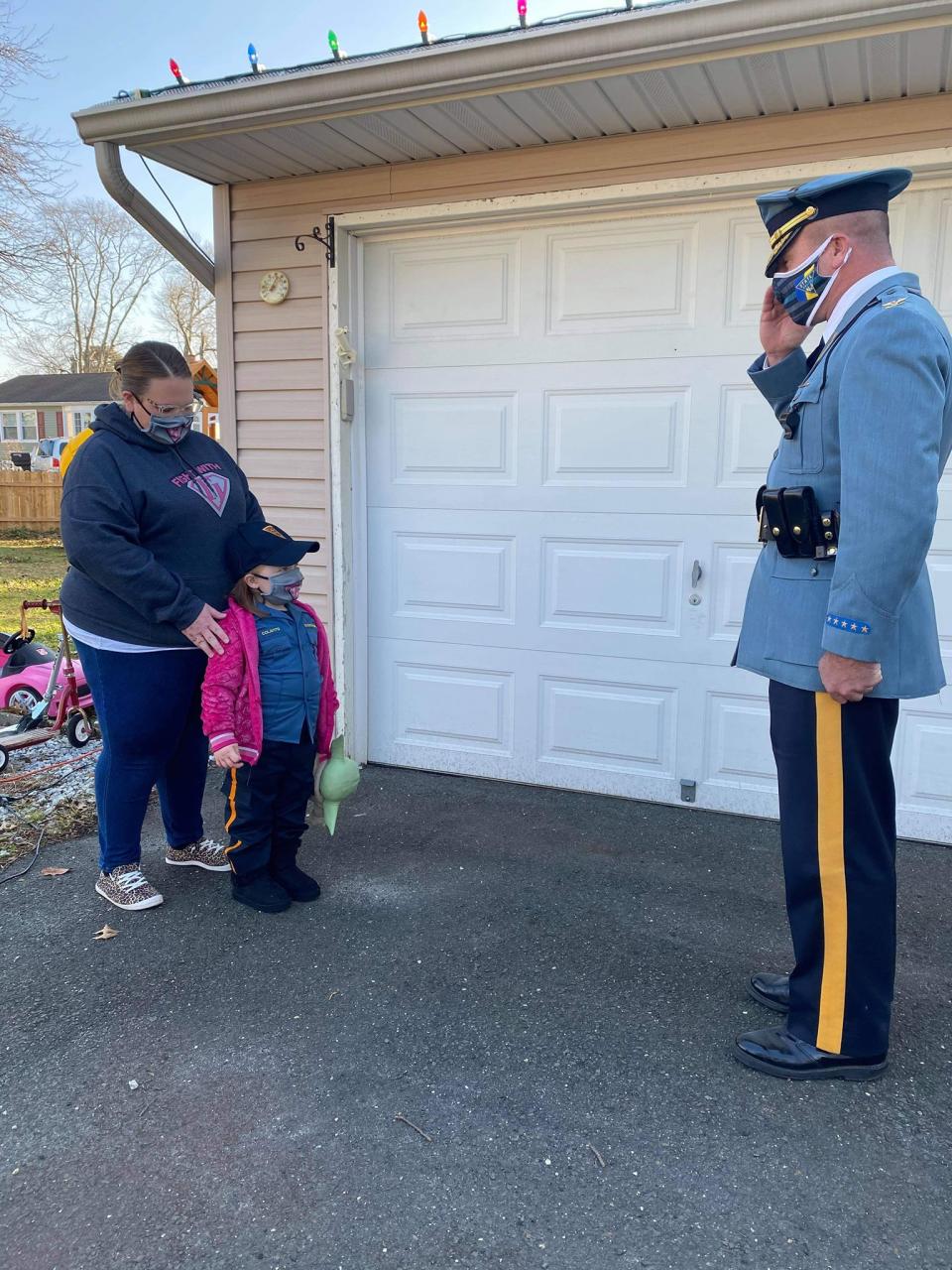 New Jersey State Police Superintendent Col. Patrick Callahan salutes Sophia Colavito after she donned her trooper uniform. (New Jersey State Police photo)