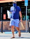 <p>Jon Hamm makes a grocery store run in L.A. on Monday in an all-blue ensemble. </p>