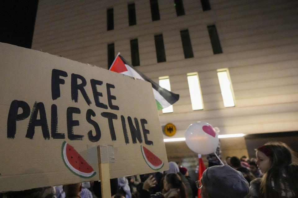 FILE - People shout slogans in front of the German embassy during a pro-Palestinian gathering in Belgrade, Serbia, Sunday, Nov. 12, 2023. Watermelons have emerged on banners, t-shirts, cars and social media over the past three months in protests against the Israel-Hamas war. From New York and Tel Aviv to Dubai and Belgrade, the fruit has caught on globally as a symbol of solidarity with the Palestinian people. (AP Photo/Darko Vojinovic, File)