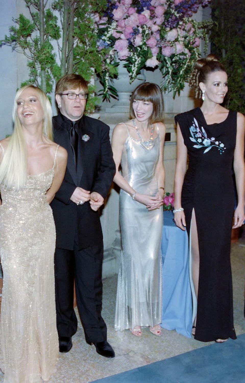 Donatella Versace, Elton John, Anna Wintour, and Julia Koch at the 1997 Met Gala.