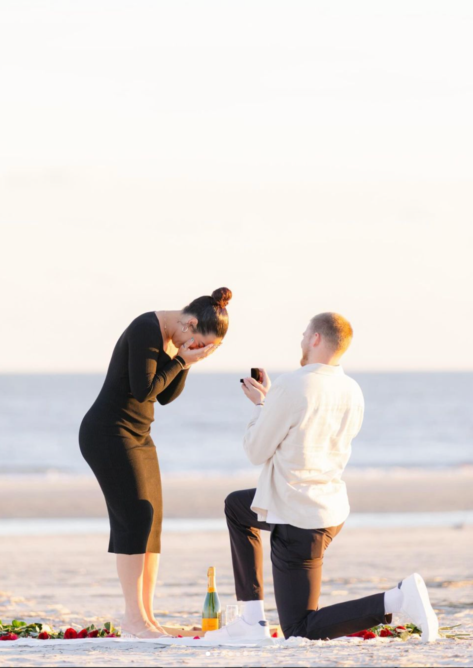 Detroit Tigers outfielder Parker Meadows, right, proposes to Hailey Sales during the offseason on the beach in Hilton Head, South Carolina.