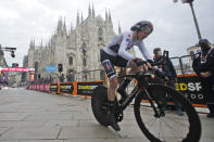 Britain's Tao Geoghegan Hart rides past the gothic cathedral after completing the final stage of the Giro d'Italia cycling race, a 15.7 kilometers (9.756 miles) individual time trial from Cernusco sul Naviglio to Milan, Italy, Sunday, Oct. 25, 2020. (AP Photo/Luca Bruno)