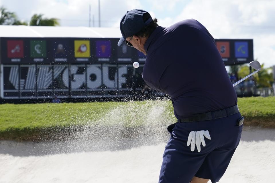FILE - Phil Mickelson hits from a sand trap on the ninth hole during the first round of the LIV Golf Team Championship at Trump National Doral Golf Club, Oct. 28, 2022, in Doral, Fla. (AP Photo/Lynne Sladky, File)