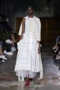 <p>This season marked Simone Rocha's 10-year anniversary, and the designer chose to focus on the topic of mother-daughter relationships. "I wanted to blow up those childlike proportions and distort them, mix them with the sleepless nights that come with having a daughter," <a href="https://wwd.com/runway/spring-2022/london/simone-rocha/review/" rel="nofollow noopener" target="_blank" data-ylk="slk:she explained;elm:context_link;itc:0;sec:content-canvas" class="link ">she explained</a>, while she also referenced "the nursing bra, the breast and the nourishing nature of the milk — sharing it and elevating it with these embellished bras."</p>