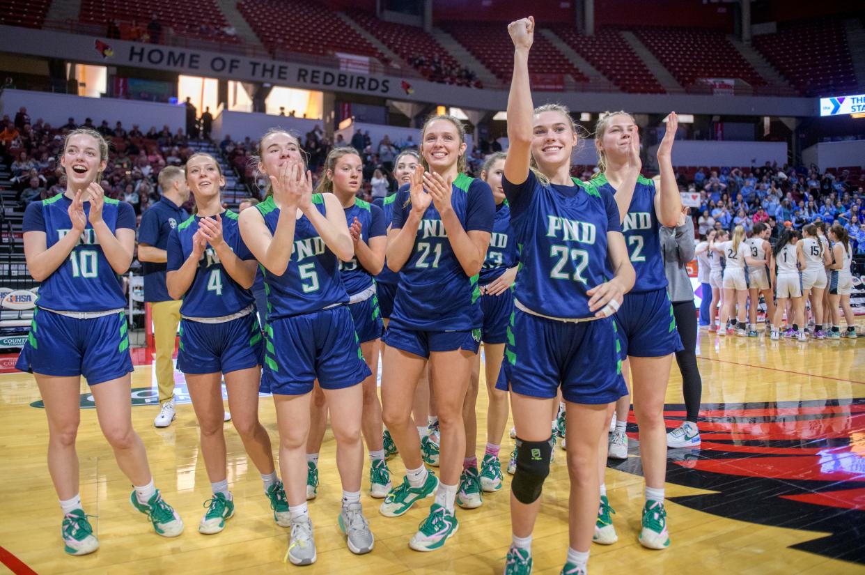 The Peoria Notre Dame Irish acknowledge their fans after their 71-25 win over Wilmette Regina Dominican in the Class 2A girls basketball state semifinal Thursday, Feb. 29, 2024 at CEFCU Arena in Normal.