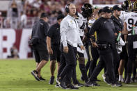 Vanderbilt coach Clark Lea, center with white jacket, looks at the scoreboard during the first half of the team's NCAA college football game against Alabama, Saturday, Sept. 24, 2022, in Tuscaloosa, Ala. (AP Photo/Vasha Hunt)