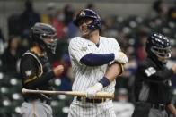 Milwaukee Brewers' Keston Hiura reacts after being hit by a pitch during the third inning of a baseball game against the Pittsburgh Pirates Friday, April 16, 2021, in Milwaukee. (AP Photo/Morry Gash)