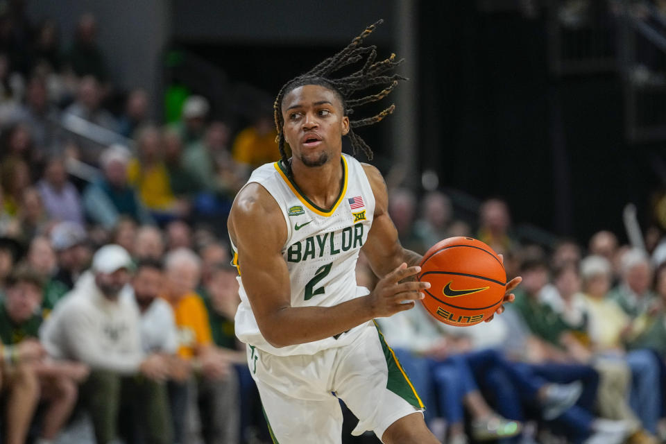 Baylor's Jayden Nunn drives to the basket against Texas during the first half of an NCAA college basketball game, Monday, March 4, 2024, in Waco, Texas. (AP Photo/Julio Cortez)