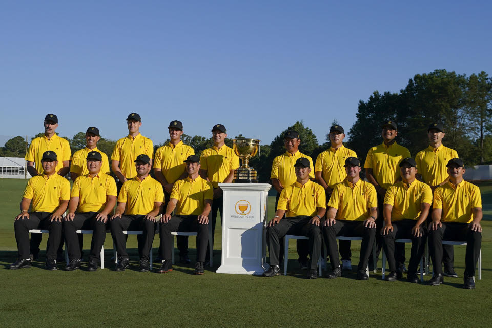 The International team sits for a portrait before practice for the Presidents Cup golf tournament at the Quail Hollow Club, Wednesday, Sept. 21, 2022, in Charlotte, N.C. (AP Photo/Julio Cortez)
