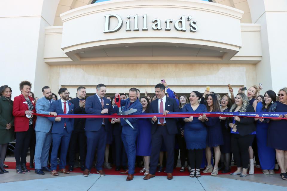 Craig Seiter, General Manager for Dillard's Amarillo, cuts the ribbon signifying the grand opening of the Women's Dillard's at Westgate Mall on Thursday morning.