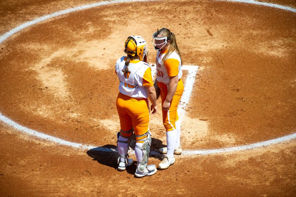 Tennessee catcher Kelcy Leach and pitcher Bailey McCachren meet at the mound during the Lady Vols vs ECU softball game at Sherri Parker Lee Stadium, Knoxville, Tenn. on Sunday, April 24, 2022.