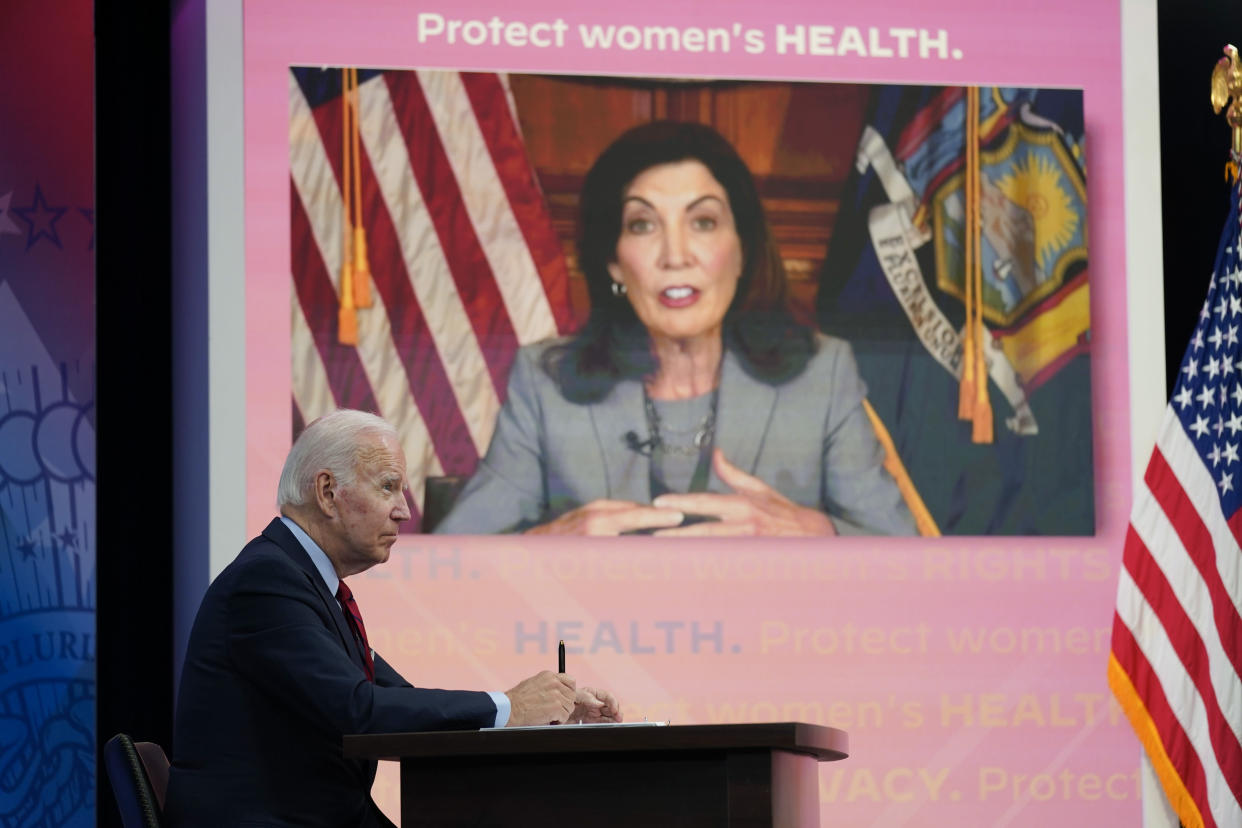 President Joe Biden listens as New York Gov. Kathy Hochul speaks during a virtual meeting with Democratic governors on the issue of abortion rights, in the South Court Auditorium on the White House campus, Friday, July 1, 2022, in Washington. (AP Photo/Evan Vucci)