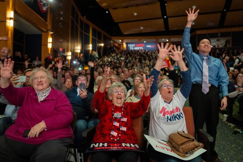 Attendees hope to catch t-shirts thrown into the audience before Republican presidential candidate Nikki Haley speaks at a rally at Exeter High School in Exeter, N.H. on Jan 21, 2024, during preparations for the New Hampshire presidential primary.