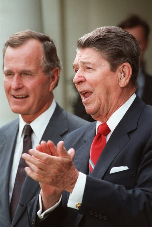 Former US president Ronald Reagan (R) and his then vice president George Bush -- shown here in 1987 -- served two terms before Bush won the White House in 1988