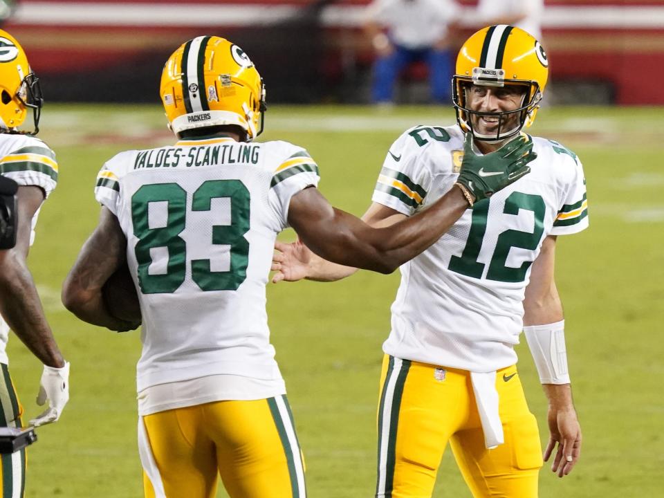 Aaron Rodgers (right) and Marquez Valdes-Scantling celebrate after connecting for a touchdown pass.