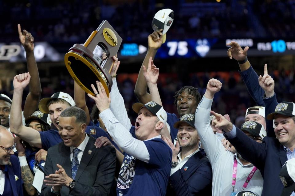 Connecticut coach Dan Hurley celebrates after the Huskies' victory over Purdue.